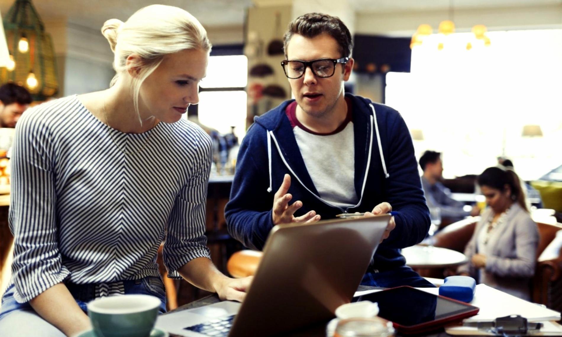 An instructor walking a small group through a budget worksheet during a live online session